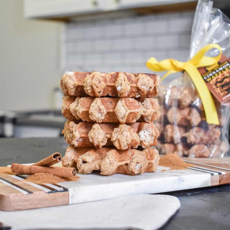 A pack of cinnamon-flavored Liège waffles with a warm, spiced aroma.